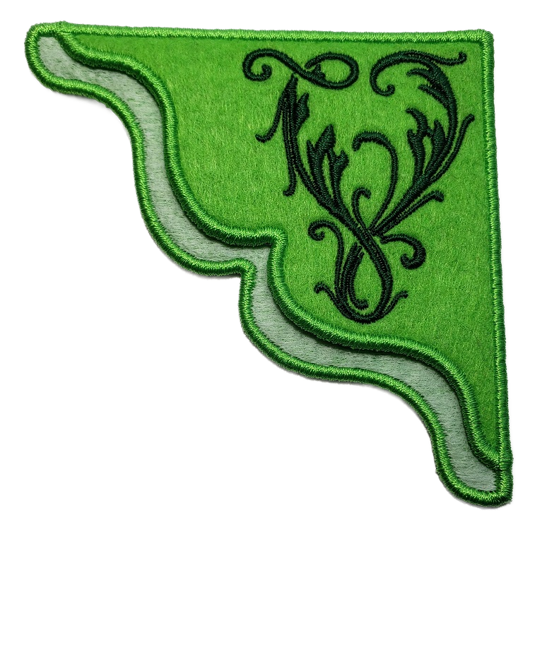 A lime green felt corner bookmark with the inital V in a vines motif